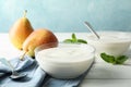 Composition with cream yogurts and fruits on white table