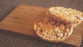 Composition with crunchy rice cakes on wooden background, side view - soft focus