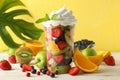 Composition cup of fresh fruit salad on white wooden table Royalty Free Stock Photo