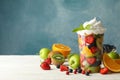 Composition cup of fresh fruit salad on wooden background Royalty Free Stock Photo