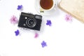 Composition with cup of tea, vintage camera, old books on white background Top view Royalty Free Stock Photo