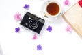 Composition with cup of tea, vintage camera, old books on white background Top view Royalty Free Stock Photo