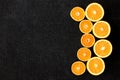 A composition of cut in halves oranges and tangerines on a black background Royalty Free Stock Photo