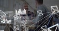 Composition of data processing, network of email icons over two businessmen talking in office Royalty Free Stock Photo