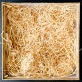 Composition with decorative straw in a box, close-up. Top view, Royalty Free Stock Photo