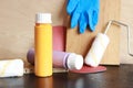 Composition of decorator and house renovation tools. Paint bottles Royalty Free Stock Photo