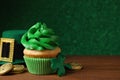 Composition with delicious decorated cupcake on table. St. Patrick`s Day celebration