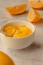 Composition with delicious Yellow lemons and Lemon curd in a sausepan white bowl on marble background Royalty Free Stock Photo
