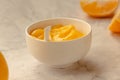 Composition with delicious Yellow lemons and Lemon curd in a sausepan white bowl on marble background Royalty Free Stock Photo