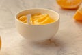Composition with delicious Yellow lemons and Lemon curd in a sausepan white bowl on marble background Royalty Free Stock Photo