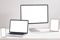 Composition of desktop computer, laptop, tablet and smartphone with copy space on white background Royalty Free Stock Photo