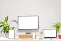 Composition of desktop computer, laptop, tablet and smartphone with copy space on white background Royalty Free Stock Photo