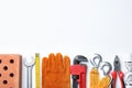 Composition with different construction tools on white background