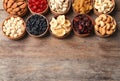 Composition of different dried fruits and nuts on wooden background, top view. Royalty Free Stock Photo