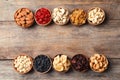 Composition of different dried fruits and nuts on wooden background, top view. Royalty Free Stock Photo