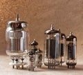 Composition of different electronic vacuum tubes on kraft paper background. Royalty Free Stock Photo