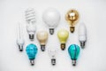 Composition with different light bulbs on white background