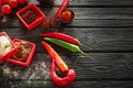 Composition with different spices and vegetables on wooden background Royalty Free Stock Photo