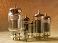 Composition of different tipes electronic vacuum tubes in warm tones. Royalty Free Stock Photo