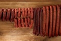 Many natural sausage hanged on wooden stick Royalty Free Stock Photo