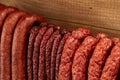 Many natural sausage hanged on wooden stick Royalty Free Stock Photo