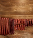 Many natural sausage hanged on wooden stick Royalty Free Stock Photo
