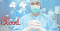 Composition of donate blood text over doctor with face mask Royalty Free Stock Photo