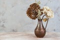 Composition of dried flowers in vintage copper jug Royalty Free Stock Photo