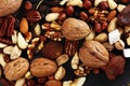 Composition with dried fruits and assorted healthy nuts on rustic background Royalty Free Stock Photo