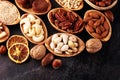 Composition with dried fruits and assorted healthy nuts in wooden bowls Royalty Free Stock Photo