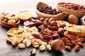 Composition with dried fruits and assorted healthy nuts in wooden bowls Royalty Free Stock Photo