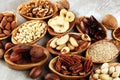 Composition with dried fruits and assorted healthy nuts in wooden bowls Royalty Free Stock Photo