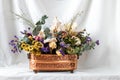 composition of dry flowers in a vase, white fabric background, still life Royalty Free Stock Photo