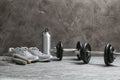 Composition with dumbbells and fitness accessories on floor. Royalty Free Stock Photo