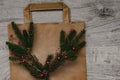 Composition, eco paper bag for Christmas purchases, with a spruce branch and decoration .