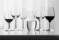 Composition of empty different types of wine glasses in shape and size on a white background. Oil painting. AI generated