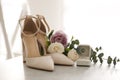 Composition with engagement ring and wedding shoes on light grey table, closeup. Bride dressing Royalty Free Stock Photo