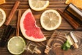 Composition with essential oils and citrus fruits on wooden background Royalty Free Stock Photo