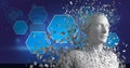 Composition of exploding human bust formed with white particles and dna strand with hexagons