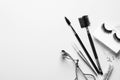 Composition with false eyelashes and tools on white background Royalty Free Stock Photo