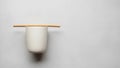 Composition featuring a simple white ceramic cup resting on a Royalty Free Stock Photo