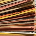 Composition featuring a stack of colorful paper sheets in shades of Royalty Free Stock Photo