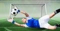 Composition of female goalkeeper catching ball at football stadium