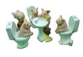Composition of five funny piglets in the toilet. Polymer clay sculptures