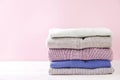 Composition with folded clothes, unisex for both man and woman, different color & material. Pile of laundry, dry clean clothing Royalty Free Stock Photo