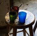 Composition of a four cups and part of a brush on a chair