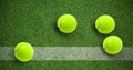 Composition of four tennis balls on grass tennis court with copy space Royalty Free Stock Photo