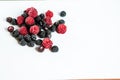 The composition of fragrant and delicious black and red raspberries on a white background are isolated in the studio Royalty Free Stock Photo