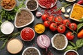 Composition with fresh aromatic spices and vegetables on dark background Royalty Free Stock Photo