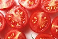 Composition of fresh cherry tomatoes sliced on a ceramic plate. cherry tomatoes, slices of cherry, Composition for design. Royalty Free Stock Photo